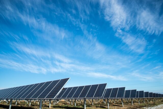 solar panels on ground under clear blue sky in united states